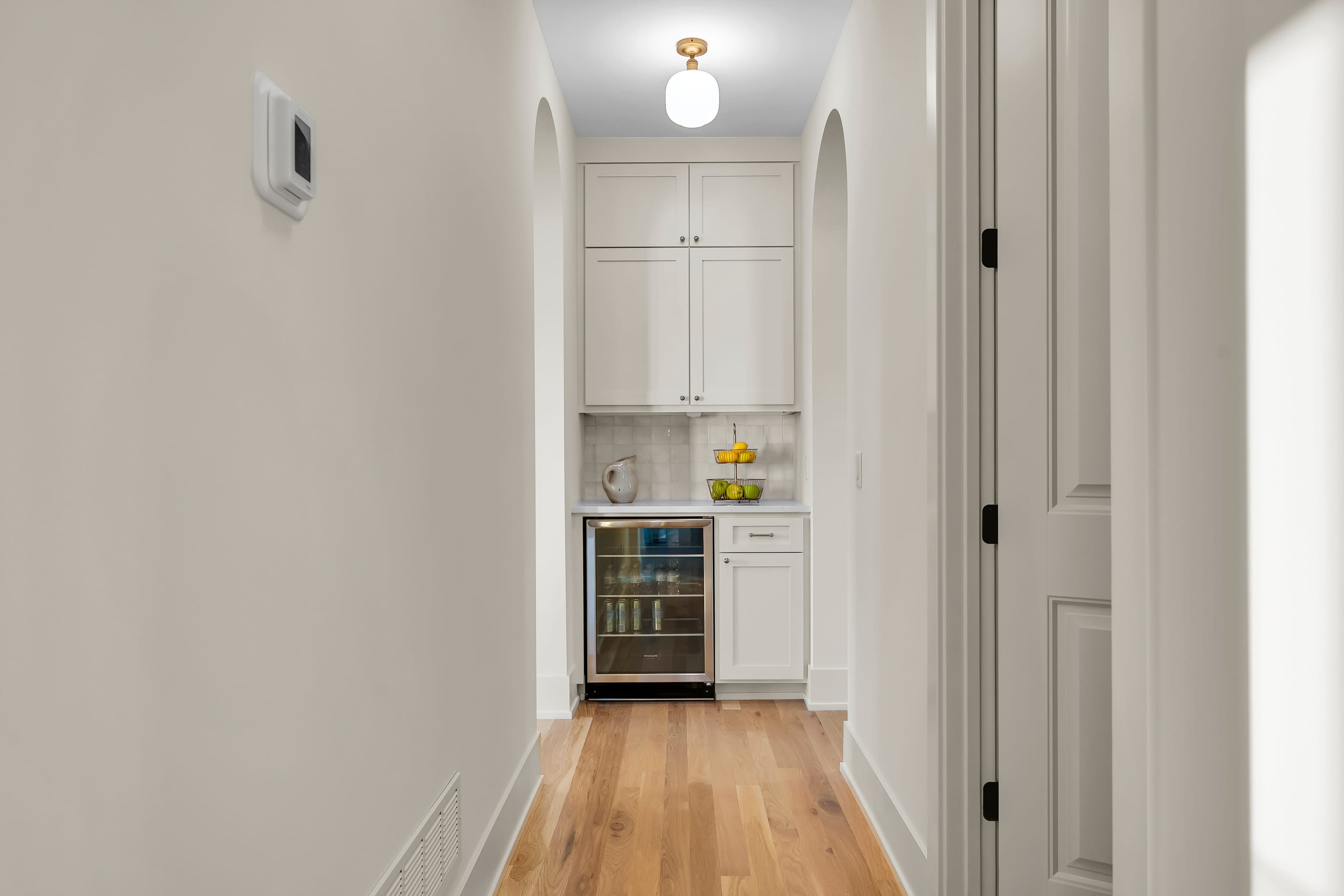 Butler's pantry with beverage cooler