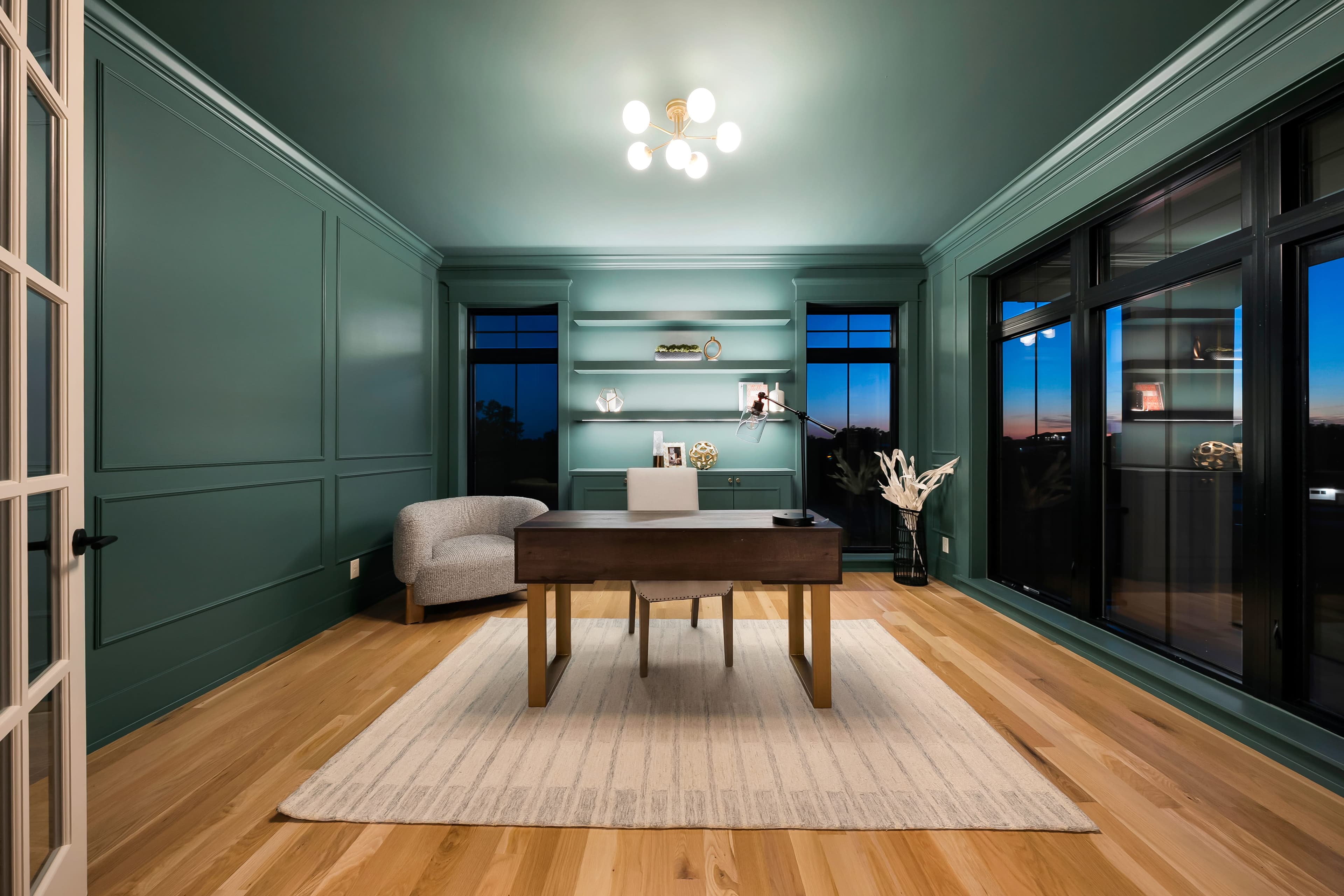 Evening view of a green paneled study